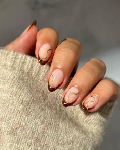 32 Fall Short Nails: Top Trends and Cute Ideas to Try This Autumn Red French With Gold Line, Almond Shape Thanksgiving Nails, October Nails Ideas Almond, November Simple Nails, Dark Brown And Gold Nails, Fearless Era Nails, Autumn Oval Nails, Fall Short Almond Nails Ideas, Autumn Holiday Nails