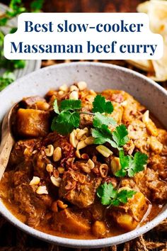 the best slow cooker massanan beef curry in a white bowl with parsley on top