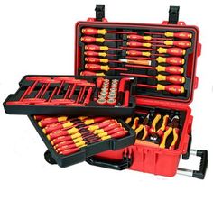 a tool box filled with lots of tools on top of a white surface and in front of it is an assortment of screwdrives