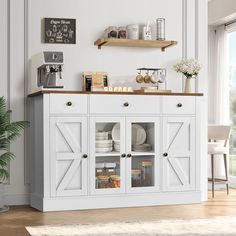 a white cabinet with open doors and shelves filled with plates, bowls and utensils