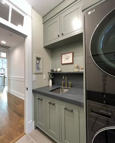 the kitchen is clean and ready to be used as a washer and dryer