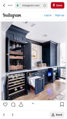 a kitchen with black cabinets and white walls is featured on the instagram page for all posts