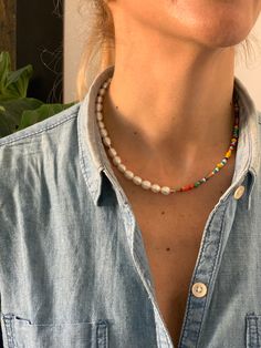 "Freshwater cultured pearls and glass mixed colors beaded necklace, a summer must wear! Necklace lenght is 45cm (17,7\"). Half made of pearls size 7x10mm (0.3\"x0.4\" approx.) half made of glass beads in mixed colors and sizes between 2mm and 4mm (0.08\"-0.15\"). Nautical 18k gold plated brass clasp measures 15mm (0.6\") in diameter. Includes a brand logo laser engraved tag. Please note, as they're genuine natural materials and handmade process, small variations on shape and color may occur. Eac Summer Pearl Beaded Single Strand Necklace, Summer Single Strand Pearl Beaded Necklaces, Summer Pearl Single Strand Beaded Necklace, Summer Single Strand Pearl Beaded Necklace, Boho Trends, Pearls Necklace, Summer Boho, Freshwater Cultured Pearls, Mixed Colors