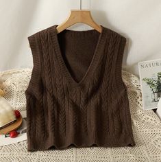 Basic sleeveless v-neck vest with a braided texture in our signature soft knit. One Size: 35.5" chest, 19.5" length Casual V-neck Cable Knit Sweater Vest, Brown Knit V-neck Vest, Trendy Textured Knit V-neck Sweater Vest, Brown V-neck Sweater Vest For Winter, Brown Knitted V-neck Top, Brown Knit V-neck Sweater Vest, Brown V-neck Knit Sweater Vest, Brown V-neck Sweater Vest For Fall, Trendy V-neck Textured Knit Sweater Vest