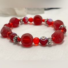 Brand New Handmade Red Stretch Bracelet With Frosted Beads And Chrome Beads And Silver Accents Red Faceted Beads Bracelet, Traditional Red Faceted Beads Bracelet, Red Bracelets With Heart Beads, Red Faceted Bead Bracelets As Gift, Red Faceted Beads Bracelet As A Gift, Red Beaded Bracelets With Faceted Beads For Gift, Red Faceted Beaded Bracelet As A Gift, Red Adjustable Stretch Bracelet For Holidays, Adjustable Red Stretch Bracelet For Holiday