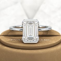 Introducing our stunning 2.50 Carat Emerald Cut Half Bezel Engagement Ring! Crafted with love, this exquisite ring features an emerald cut lab grown diamond set in 14K or 18K yellow gold. Its minimalist design exudes elegance, making it a perfect choice for your proposal. Trust us, this ring will leave her breathless!𝐅𝐞𝐚𝐭𝐮𝐫𝐞𝐬:• 𝐌𝐚𝐝𝐞 𝐭𝐨 𝐎𝐫𝐝𝐞𝐫• 𝐌𝐞𝐭𝐚𝐥: 𝟏𝟒𝐊 𝐆𝐨𝐥𝐝 | 𝟏𝟖𝐊 𝐆𝐨𝐥𝐝 | 𝟗𝟓𝟎 𝐏𝐥𝐚𝐭𝐢𝐧𝐮𝐦 • 𝐁𝐚𝐧𝐝 𝐂𝐨𝐥𝐨𝐫𝐬: Rose Gold, Yellow Gold & White Gold• 𝐁 Luxury Solitaire Emerald Cut Diamond Ring, Elegant Emerald Solitaire Ring With Baguette Cut, Elegant Solitaire Emerald Cut Diamond Ring, Classic Emerald Cut Lab Grown Diamond Wedding Ring, Elegant Emerald Cut Solitaire Diamond Ring, Refined Emerald Cut Moissanite Jewelry, Elegant Radiant Cut Diamond Ring Gia Certified, Elegant Octagon Emerald Ring In White Gold, Elegant Emerald Cut Emerald Ring In Platinum