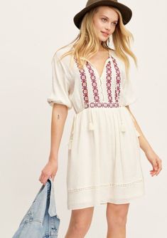 Boho Embroidered Mini Dress | LOVESTITCH Embroidered Mini Dress For Vacation, Bohemian Boho Dress With Short Sleeves For Brunch, Bohemian White Half Sleeve Dress, Casual White Dresses With Tassel Ties, Casual White Dress With Tassel Ties, Embroidered Mini Dress For Summer, Summer Mini Dress With Floral Embroidery, Embroidered Mini Summer Dress, Embroidered Summer Mini Dress