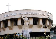 the statue of jesus is in front of the building that says saint paul the apostle