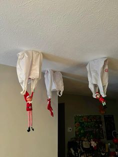 three christmas decorations hanging from the ceiling