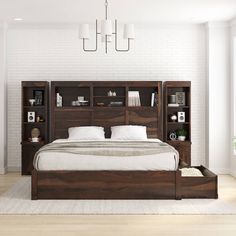 a bedroom with a bed, bookshelf and nightstands on the side in front of a white brick wall