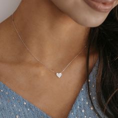 Make a sweet and stylish statement in this glamorous heart necklace. Crafted of 18K white gold, this pave' diamond mini heart necklace floats on an adjustable cable link chain and will send a message of affection to your loved one! Curate an eye-catching statement look by matching this with the other natural beauties from our Diamond Jewelry Collection. Natural Diamonds: 0.20ctw 18K White Gold Length: 18 Inches Luxury Heart-shaped Single Diamond Necklace, Luxury Dainty White Gold Heart Necklace, Luxury White Heart Cut Heart Necklace, Luxury White Gold Heart Necklace, Luxury Elegant White Gold Heart Necklace, Cheap White Gold Heart Necklace, Luxury White Gold Solitaire Heart Cut Necklace, Luxury White Gold Elegant Heart Necklace, Luxury White Gold Heart Solitaire Necklace