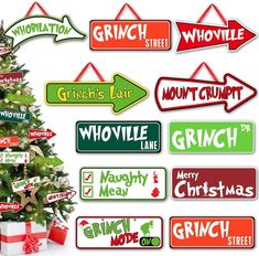 a christmas tree with many different signs on it