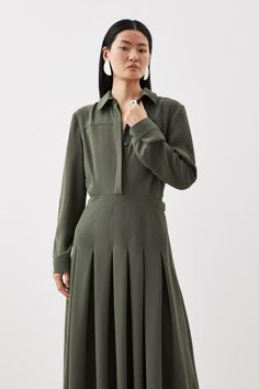 This Instantly-Elegant Shirt Dress Is Tailored With Languid Proportions, Rendered From A Soft Jersey Fabric That Effortlessly Cascades To An Ankle-Grazing Length. This Point-Collar Piece Is Cut With A Sculpted Waist That Defines The Long-Sleeved Bodice Before Easing Into A Flowing Skirt. Pair This Dress With Leather Boots For Elevated Style.Long Sleevesmaxi Lengthshirt Dresssoft Pleats Elegant Dresses Green, Fitted Pleated Long Sleeve Shirt Dress, Long Sleeve Cotton Pleated Shirt Dress, Ankle Length Dress Casual, Office Midi-length Pleated Shirt Dress, Chic Pleated Sleeve Button-up Shirt Dress, Luxury Midi-length Shirt Dress With Pleated Sleeves, Elegant Shirt Dress, Pleated Shirt Dress