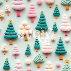 colorful christmas trees are arranged on a white surface