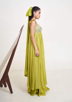 Introducing the emilie anarkali, a masterpiece crafted from the finest georgette and chanderi silk, now available in a captivating lime green hue. This ensemble exudes timeless elegance with its flowing silhouette and exquisite craftsmanship. Anarkali Style Floor-length Pista Green Palazzo Set, Green Palazzo Set With Sheer Dupatta In Traditional Drape, Green Floor-length Palazzo Set For Navratri, Green Silk Cutdana Dress, Floor-length Green Palazzo Set With Resham Embroidery, Green Floor-length Palazzo Set With Resham Embroidery, Green Resham Embroidery Floor-length Palazzo Set, Green Silk Anarkali Set, Green Georgette Gown With Cutdana