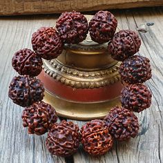 📿This Bracelet is handcrafted with Nepali 5 Mukhi Rudraksha Beads. The 5 Mukhi Rudraksha (Five Faced Rudraksha ) is one of the most popular forms of rudraksha that symbolises prosperity and success in life. It is known for releasing the person from all kinds of unwanted bonds in life and fulfils the desires of the wearer over time. This rudraksha balanced all the chakra points. This five Mukhi Rudraksha is known as the most powerful rudraksha among all rudraksha. This Rudraksha is also known as Handmade Brown Beaded Bracelets For Ceremonial Use, Handmade Brown Beaded Bracelets For Rituals, Bohemian Bracelets With Latkans For Diwali, Adjustable Traditional Bracelets For Rituals, Spiritual Brown Bracelet For Rituals, Traditional Hand Wrapped Brown Bracelet, Bohemian Bracelets For Puja During Diwali, Bohemian Bracelets For Puja And Diwali, Spiritual Hand-strung Beaded Bracelets For Rituals