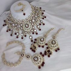 Gold Rodium Polish Red and Maroon color Necklace in Metal Alloy studded with CZ Diamond, Kundan, Pearl Tika Jewelry, Maroon Necklace, Nath Nose Ring, Bollywood Bridal, Buy Jewellery Online, Color Necklace, Metal Necklace, Kundan Necklaces, White Necklace