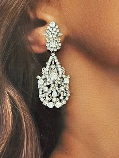 Our luxurious and glamourous DILARA earrings are perfect for any occasion. It's silhouette is created with light-catching crystals to reflect its beauty. They will create a polished look with little effort for a high-style special event. Handcrafted Highest Quality Swarovski / Cubic Zirconia Platinum plated Guards against scratches and tarnish. approximate size 2.06" length 1" width Nickel free Free shipping in USA Classic Wedding Themes, Earrings For Bride, Teardrop Bridal Earrings, Artistic Earrings, Crystals Earrings, Bridal Earrings Chandelier, Crystal Bridal Tiaras, Boutique Couture, Bridal Necklace Set