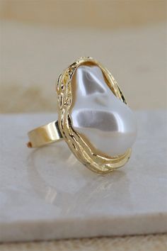 This fully adjustable Baroque Pearl Ring offers a unique accent to any style. Its retro shaped design complements the glossy baroque pearl for a classic fashion look. Enjoy the timeless combination of simplicity and sophistication in this fashion ring. Material: faux pearl, alloyProcessing: ElectroplatingSize : Adjustable Elegant Metal Pearl Open Ring, Elegant Pearl Open Ring In Metal, Elegant Open Metal Pearl Ring, Elegant Baroque Pearl Drop Ring, Elegant Baroque Pearl Open Ring, Elegant Gold Pearl Ring With Baroque Pearl, Elegant Gold Baroque Pearl Ring, Classic Fashion Looks, Statement Rings Unique