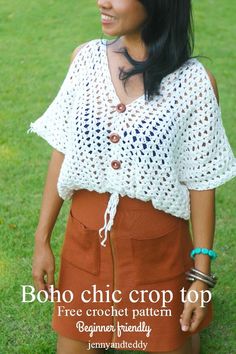 a woman standing in the grass wearing a white crochet top and brown skirt