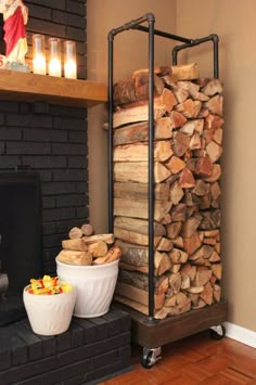 a stack of logs sitting on top of a table next to a bowl of fruit