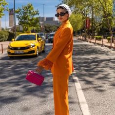 This is two-piece suit is the perfect combination of style and professionalism. The orange color will match any skin tone with ease, while the feather trim will make you look both feminine and chic. Elegant Orange Pants For Fall, Elegant Orange Fall Pants, Orange Long Sleeve, Feather Trim, Long Sleeve Blazers, Skin Tone, Orange Color, Skin Tones, Pants Set