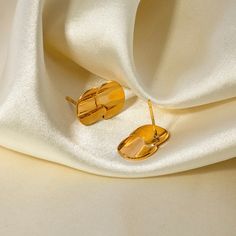 Introducing the Lea Earrings, the perfect accessory for those who prefer a minimalist look with a touch of shine. These high polish earrings are sure to elevate any outfit with their sleek and simple design. A must-have for any jewelry collection! They are made to last , hypoallergenic and waterproof 18K PVD Gold Plated 316L Stainless Steel .70 inches high x .47 inches wide Minimalist Metal Clip-on Earrings For Gift, Elegant Gold Earrings With Simple Design, Elegant Simple Design Gold Earrings, Elegant Simple Gold Earrings, Elegant Drop Earrings With Simple Design, Modern Gold-plated Earrings As Gift, Modern Gold Plated Earrings For Gift, Elegant Simple Drop Earrings, Minimalist Formal Cartilage Earrings Pair