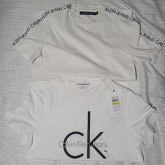 2 Shirts One Used But In Great Condition The One With The Words On The Side The Other Brand New. Calvin Klein Basic Short Sleeve Tops, Calvin Klein Crew Neck T-shirt With Logo, Calvin Klein Logo Print Crew Neck T-shirt, Calvin Klein Graphic Tee For Streetwear, Calvin Klein Cotton T-shirt With Logo Print, Calvin Klein Cotton Logo T-shirt, Calvin Klein Graphic T-shirt For Streetwear, Calvin Klein Crew Neck Top With Logo Print, Calvin Klein Logo Print Crew Neck Top