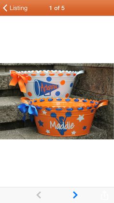 two buckets decorated with orange and blue decorations