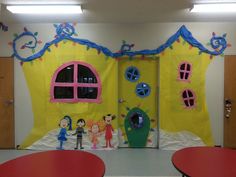 a classroom door decorated with children's artwork and decorations