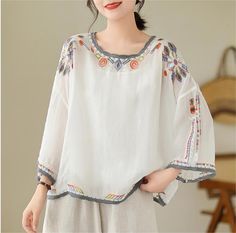 Details: Type: Women Loose Embroidered Cotton T-Shirts Material: Cotton Sleeve Length: 3/4 Sleeves Pattern: Embroidered Color: White, Gray, Apricot Style: Loose Size Bust Length cm inch cm inch M 118 46.46 60 23.62 L 122 48.03 61 24.02 XL 126 49.61 62 24.41 2XL 130 51.18 63 24.80 Raglan Sleeve Blouse, Embroidery Edge, T Shirt Embroidery, Shirt Embroidery, Vest Shirt, Loose Tops, Women Trends, Blouse Vintage, Sleeves Pattern