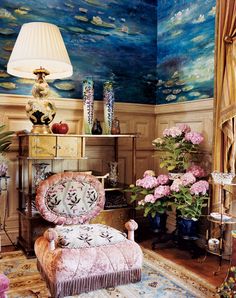 a living room filled with furniture and flowers