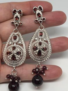 Vintage 925 Sterling Silver Bohemian Garnet dangle Chandelier Earrings Lovely handmade silver work About 2.5 inch 92.5% Sterling Silver All jewelry is shipped free in the US in a nice gift box. Check out our over a THOUSAND great reviews Silver Teardrop Chandelier Earrings With Latkans, Sterling Silver Festive Drop Chandelier Earrings, Sterling Silver Festive Dangle Chandelier Earrings, Sterling Silver Dangle Chandelier Earrings For Festive Occasions, Silver Pierced Chandelier Earrings For Festive Occasion, Festive Sterling Silver Chandelier Earrings For Pierced Ears, Festive Sterling Silver Chandelier Earrings, Traditional Sterling Silver Teardrop Earrings, Traditional Silver Teardrop Earrings With Intricate Design