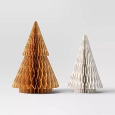 two paper christmas trees on a white background