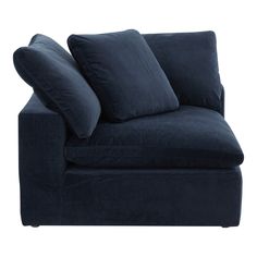 a blue couch with two pillows on it's back and one arm facing the camera