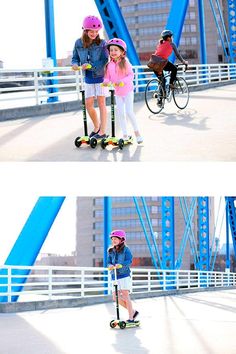 two girls are riding scooters on the bridge