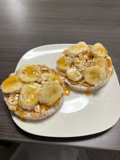 two pieces of bread topped with bananas and peanut butter