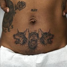 a person with tattoos on their stomach