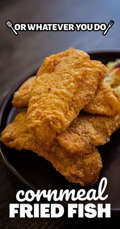 fried fish on a black plate with the words, what ever you do? commeal fried fish