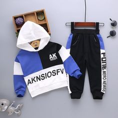 2-piece Color-block Hoodie & Pants for Children Boy - PrettyKid Blue Hooded Sets For Spring, Blue Hooded Spring Sets, Blue Cotton Patchwork Sets, Casual Blue Winter Sets, Blue Patchwork Sets With Long Sleeves, Blue Patchwork Long Sleeve Sets, Blue Long Sleeve Patchwork Sets, Casual Blue Letter Print Sets, Winter Cotton Blue Sets