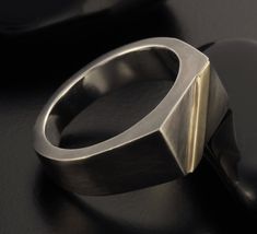 Mens Signet Ring, This piece is packed in a beautiful jewelry box, and is ready to be given as a meaningful gift. Features: ◆ Sizes: 4-16(US) ◆ Width: 8.9 mm. ◆Height from finger 3.5 mm at the top. ◆ Made of Sterling silver & 14K Gold . Please note, the ring is handmade, the coating levels and texture marks can vary from one ring to the next. ◆Engraving - I'd be happy to add a personal engraving. To make your unique ring even more special, please add the following item to your cart: www.etsy Modernist Polished Signet Ring As Gift, Modernist Polished Finish Signet Ring As Gift, Modernist Signet Ring For Formal Occasions, Modernist Formal Signet Ring, Rustic Mens Rings, Men Ring Silver, Mens Signet Ring, Signet Ring Silver, Silver Ring Designs