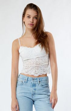 Embrace feminine elegance with the Lace Cami Top from LA Hearts. This timeless cami features delicate lace fabric with added stretch, creating a chic and romantic look. Perfect for layering or standing on its own, the Lace Cami Top adds a touch of sophistication to any outfit.


	Allover lace fabric
	Good stretch
	Semi-sheer
	V-neckline
	Adjustable straps
	Cropped length
	Scalloped hem
	Self: 90% nylon, 10% spandex; Lining: 100% polyester
	Machine washable
	Model is wearing a size small Fitted Lace Camisole With Built-in Bra, Flirty Lace Camisole For Spring, Spring Lace Camisole Top, Chic Delicate Lace For Summer, Spring Lace Cami Top With Lace Bodice, Spring Lace Cami Top With Built-in Bra, Lace Fitted Tank Top With Built-in Bra, Summer Lace Camisole With Lace Bodice, Summer Delicate Lace Cami Top