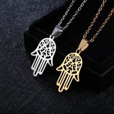 Introducing our Hamsa Hand Necklace – a symbol of protection and positive energy crafted with precision and style. This exquisite piece is made from durable stainless steel, ensuring longevity and a timeless appeal. Specifications: Material: Stainless Steel Size: 2cm wide x 3.1cm high (approximately 0.79 inches wide x 1.22 inches high) Chain Length: 20 inches Colors: Available in Silver and Gold The Hamsa Hand, a universal symbol of luck and protection, takes center stage in this finely crafted Evil Eye Choker, Hamsa Hand Necklace, Hand Pendant, Hand Necklace, Gold Hands, Stainless Steel Pendant, Hamsa Hand, Stainless Steel Necklace, Black Rings