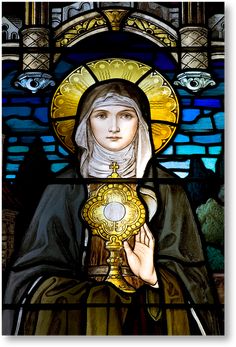 a stained glass window with a woman holding a golden object in her hand and looking at the viewer