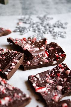 pieces of chocolate with peppermint and crushed candy canes