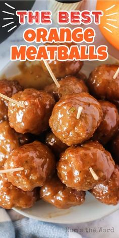 the best orange meatballs on a plate with toothpicks