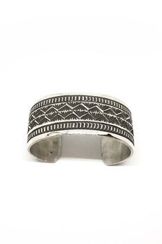 This beautiful oxidized sterling silver cuff made by Navajo artist Maloney has been hand stamped with traditional Navajo designs. This is a high quality bracelet made from thick sterling silver sheets. It is domed and curved for a comfortable fit and oxidized to bring out the details of the designs. If you have always wanted a statement bracelet that looks great with all of your silver jewelry, this is the one. Completely handmade in New Mexico. Hallmarked "MALONEY" and Stamped "Sterling". Fits Navajo Designs, Native American Bracelets, Silver Eagle, Silver Eagles, Statement Bracelet, Sterling Silver Cuff, Silver Cuff, Silver Bracelets, Jewelry Care