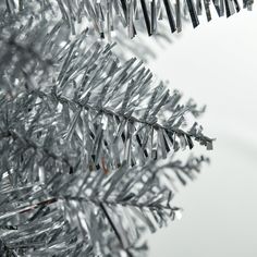 a close up view of a silver christmas tree