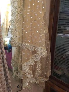 More dupatta here in our collection https://www.etsy.com/shop/neelcreations/?section_id=15880219 Net with embroidery Indian dupatta. It has beautiful golden border. Scallop border with dull gold color. ★ The mirror on all over net is not real. ★ It can be made in other colors and longer in length also. We can also change the border if you want. Approximate length 88-90 inches. We can increase length so please contact us if you want longer dupatta. These designer dupattas are very much in trend. Traditional Sharara With Sheer Dupatta And Kundan, Festive Anarkali Dupatta With Mirror Work, Anarkali Dupatta With Dabka Work For Diwali, Diwali Anarkali Dupatta With Dabka Work, Traditional Drape Sharara With Dupatta In Chinon, Sharara With Dupatta In Chinon And Traditional Drape, Traditional Sharara With Sheer Dupatta In Chinon, Traditional Chinon Sharara With Sheer Dupatta, Dola Silk Anarkali Set With Sheer Dupatta For Festivals