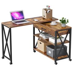 a laptop computer sitting on top of a wooden desk next to a shelf filled with books